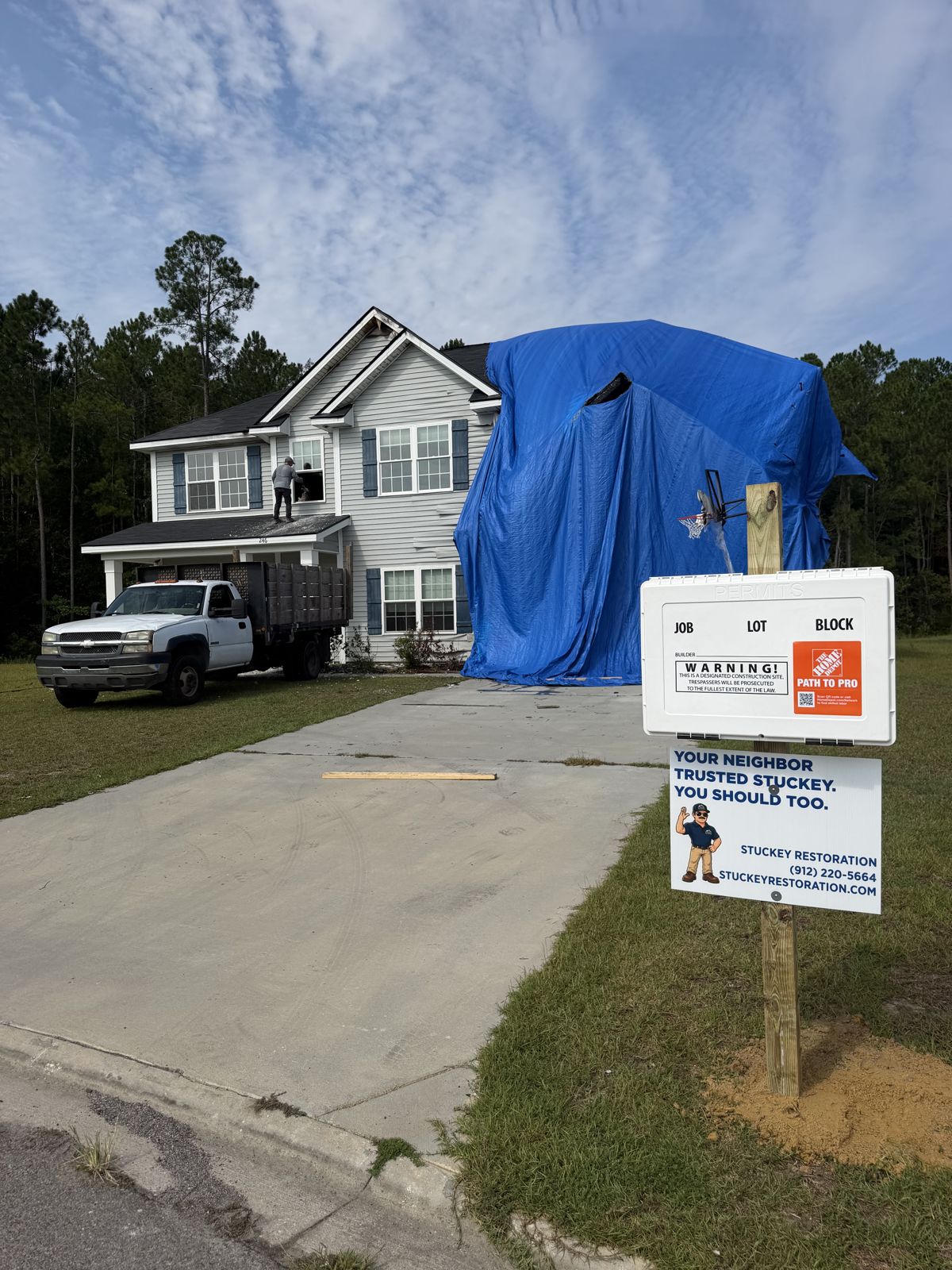 Storm-damaged home tarped by the Stuckey crew